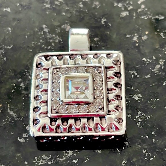 Roman Jewelry Jewelry - Roman brand charm, silver-tone, white stone, measures 3/4” X 1”